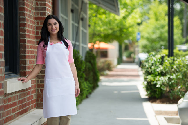 White butcher-style bib apron with center divided pocket