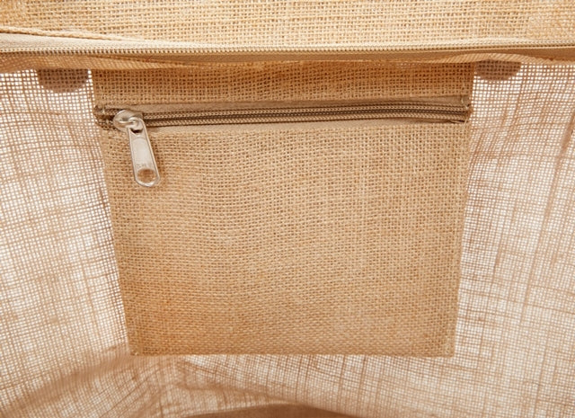 Interior zippered pocket detail of the large jute tote bag